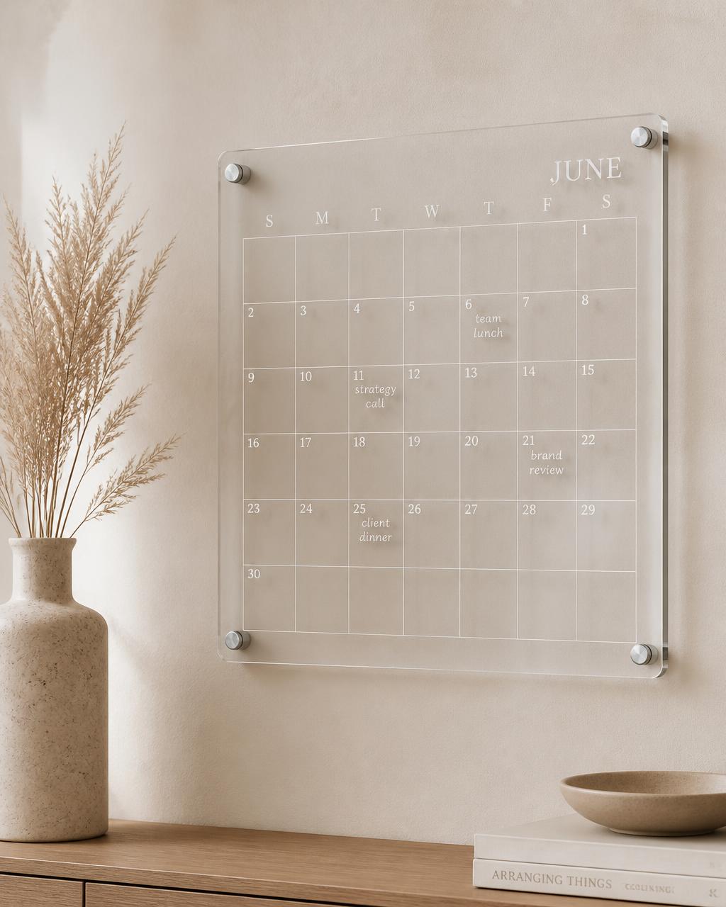 Clear acrylic monthly wall planner with silver stand-off pins