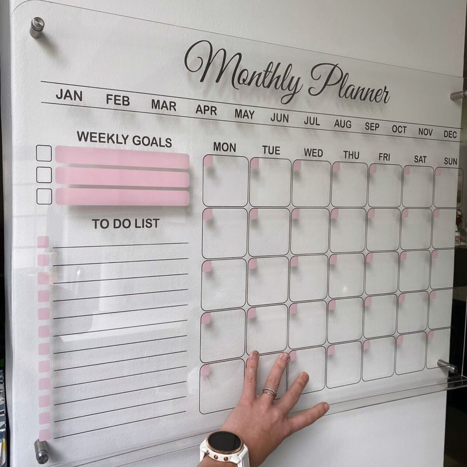 Frosted monthly planner with pink accents
