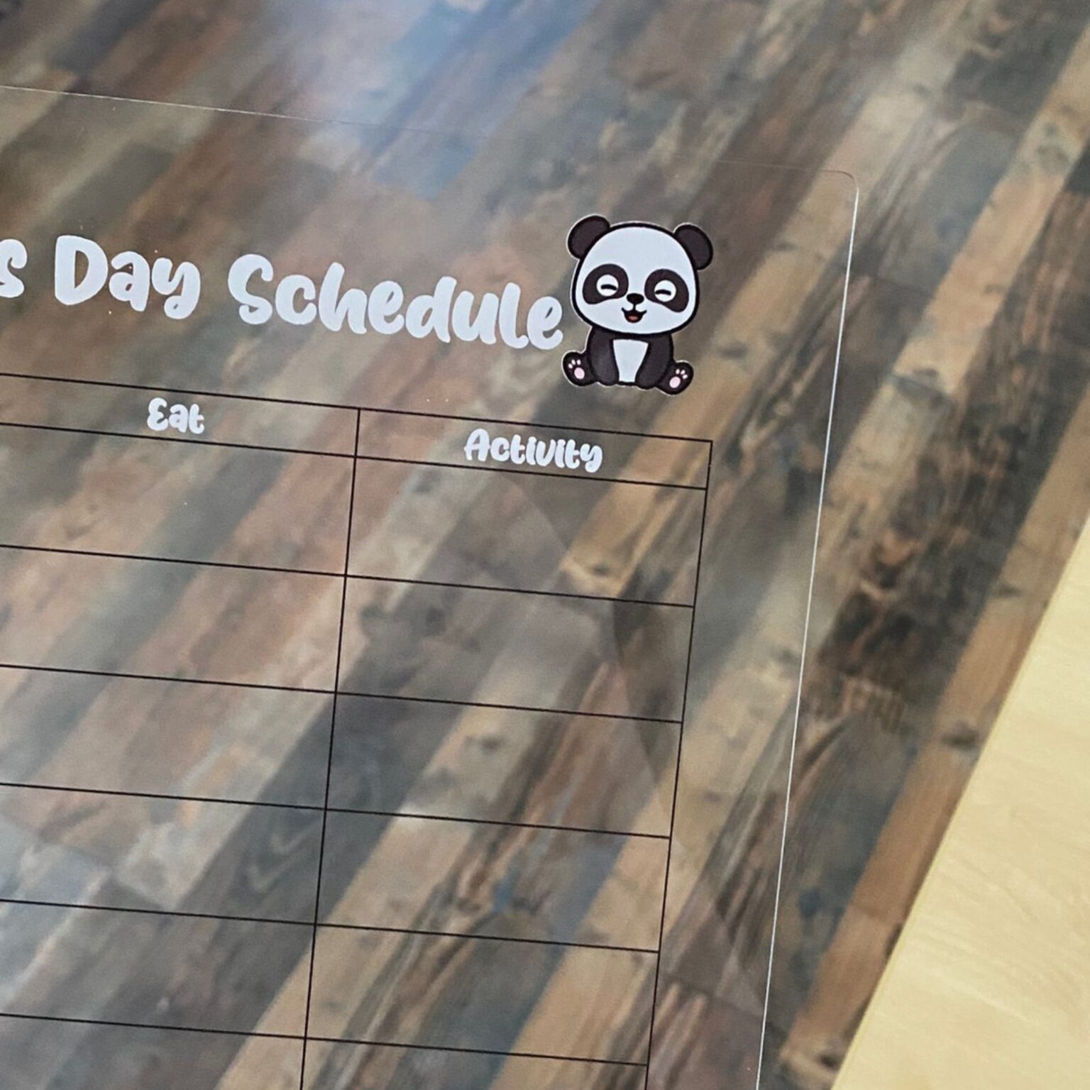 Clear acrylic day schedule board with panda illustration